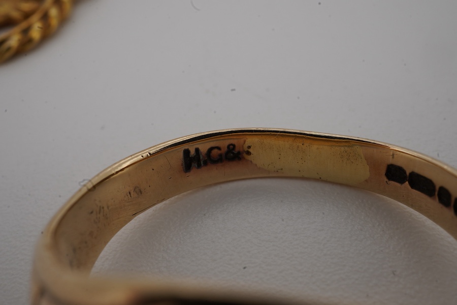 A 9ct gold and diamond set signet ring, size M/N, a fluted 9ct gold ring and a 9ct gold St. Christopher's charm, gross weight 13.2 grams.
